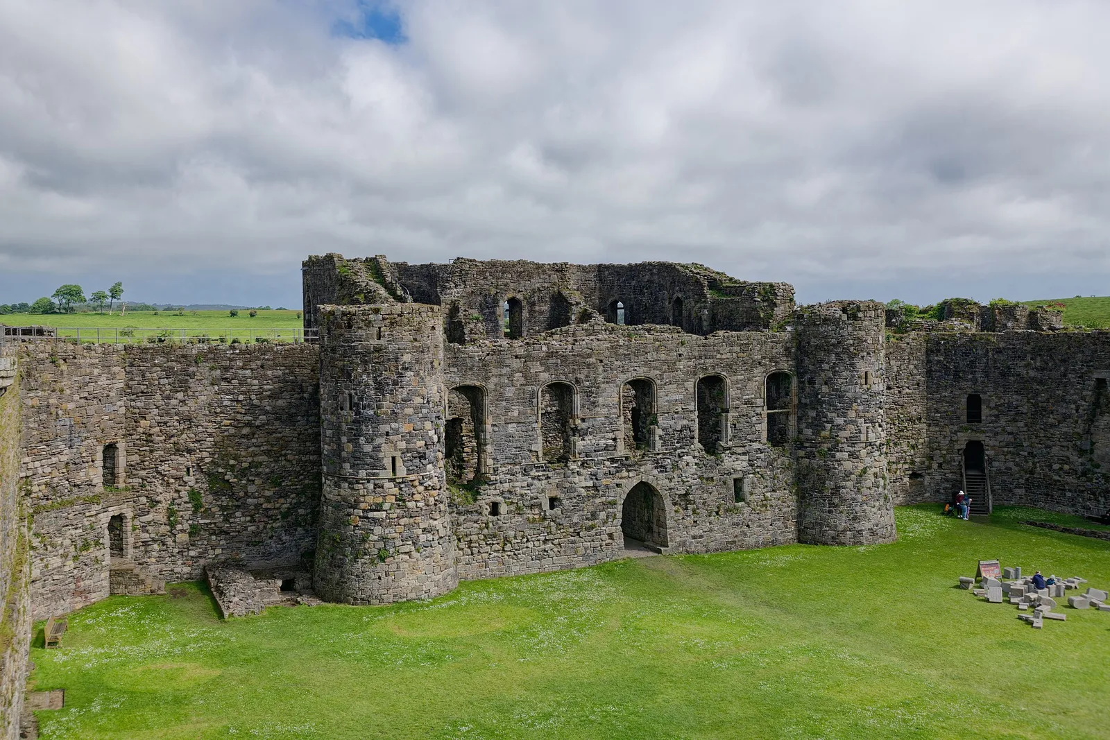 The north gatehouse of Beaumaris Castle seen from the top of the west walls, its twin towers framing the inner ward.